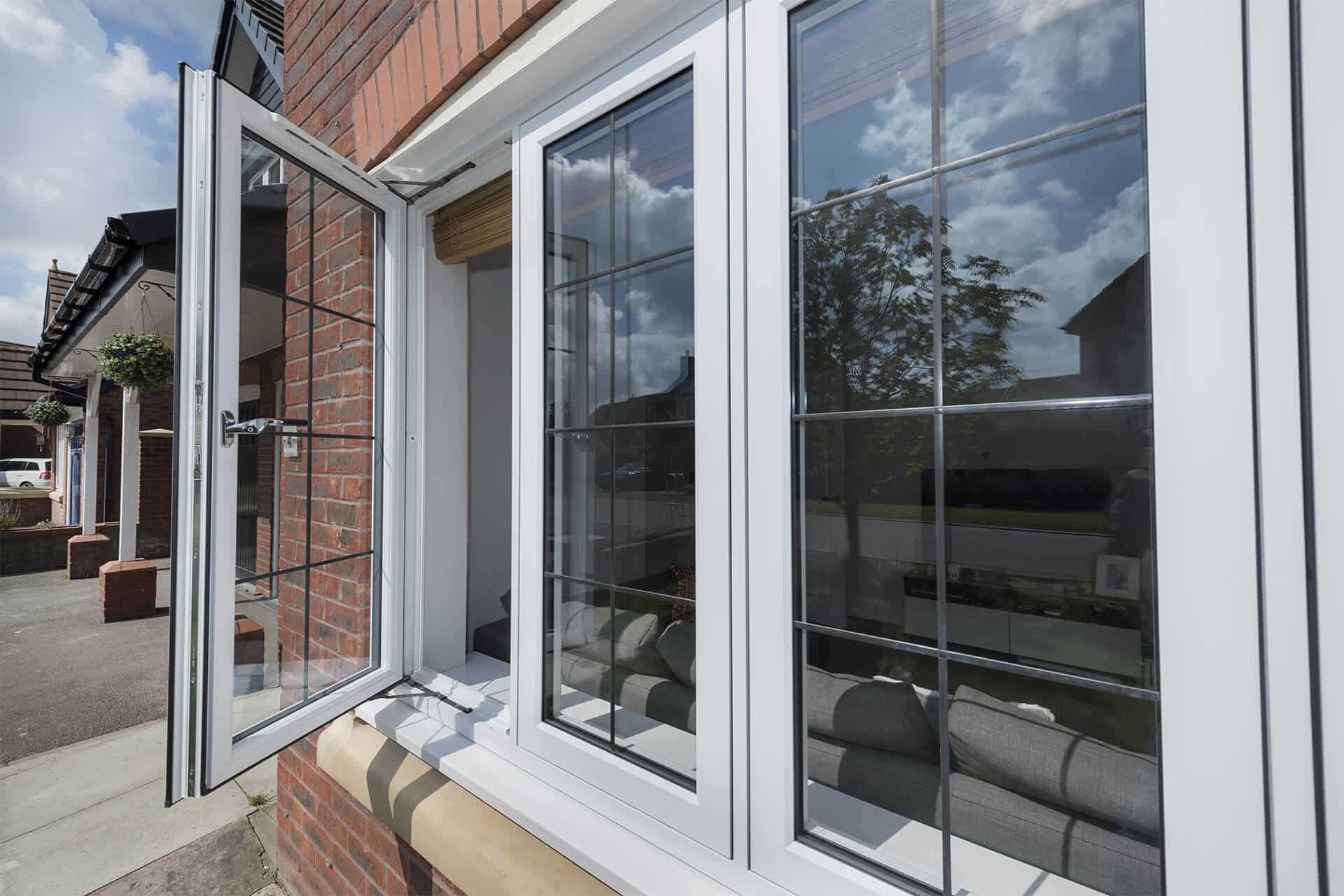 Close-up view of face brick house with white uPVC windows